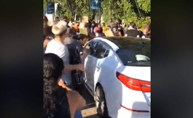 [VIDEO] Protesters Block Highway, Blocking In Vehicle With Child Inside, Smash Window