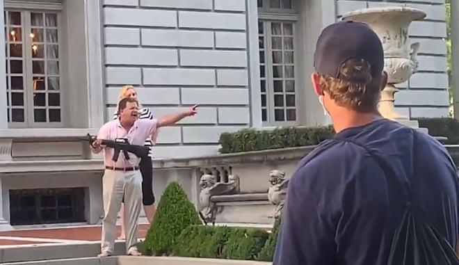 [VIDEO] Couple Points Guns At Protesters As They Walk Past Their Home, Showing Poor Gun Handling Skills Along The Way