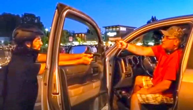 [VIDEO] Protester And Driver Face Off With Guns Pointed At Each Other In Oregon