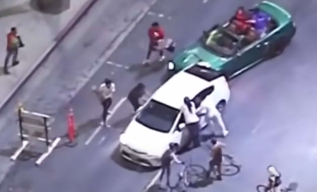 Insane Video Shows Driver Being Chased And Attacked By Rioters