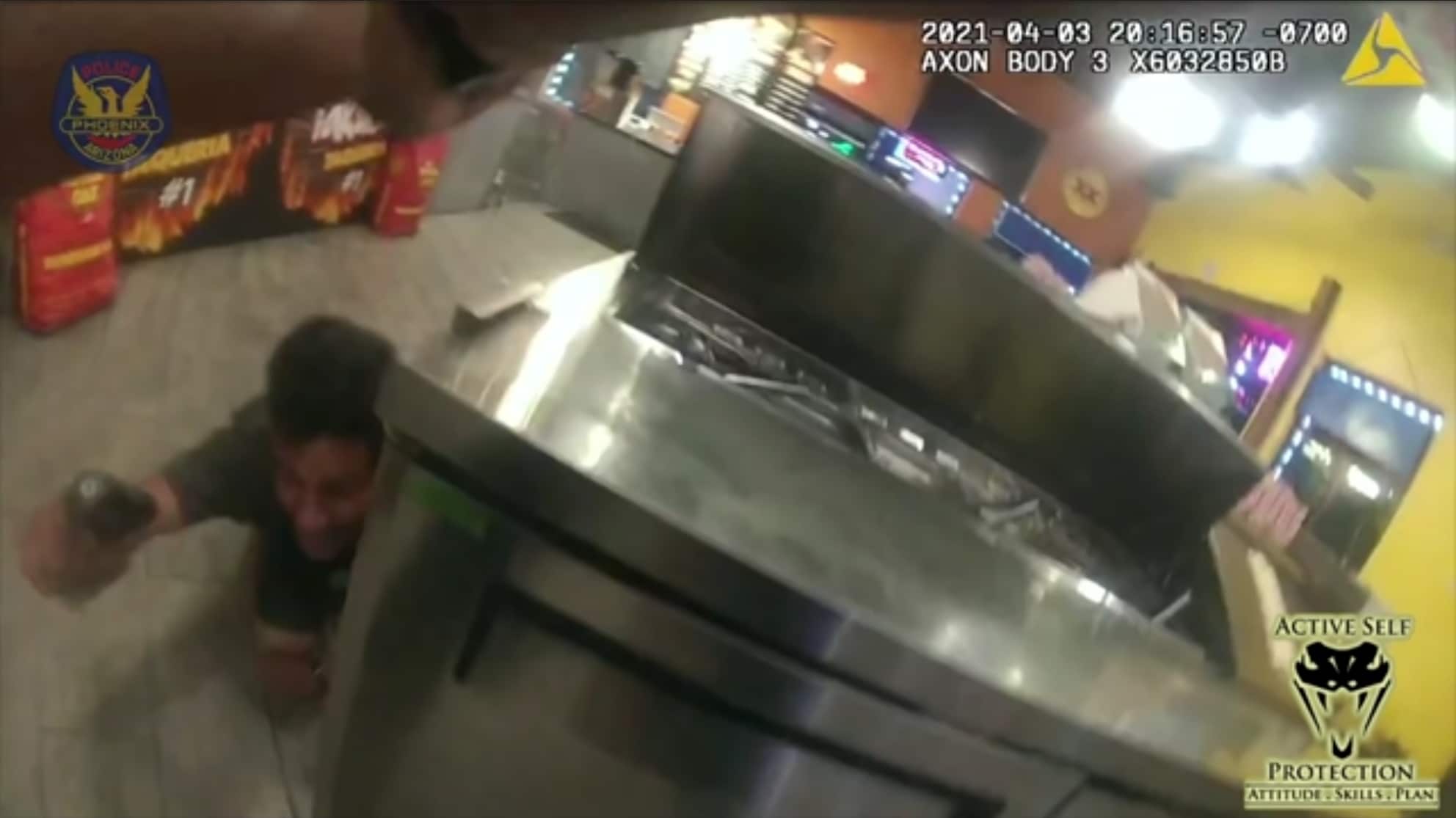 Graphic Video Shows Officer Taking Down Armed Suspect Inside Restaurant