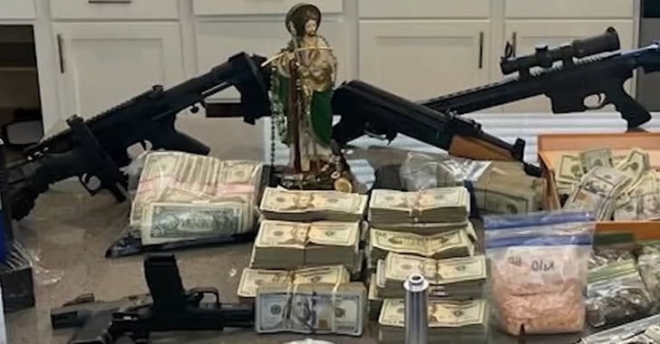 Drug Den Raid Yields Cash, Drugs, 11 Guns, And Murder Suspect From Another State