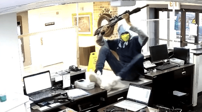 Armed Hotel Employee Has A Surprise For This Armed Robber With A Rifle