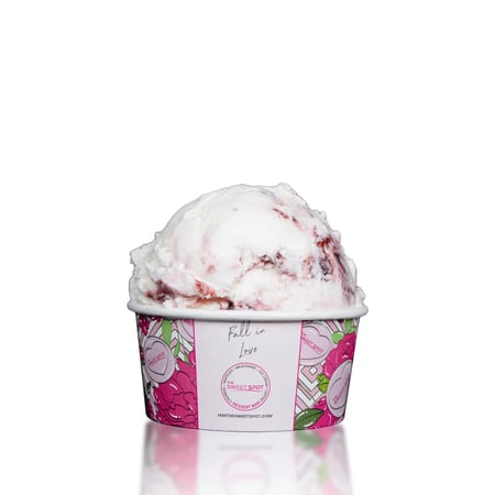 White chocolate ice cream with raspberry swirls and raspberry-filled chocolate cups.
