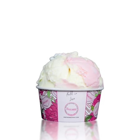 A creamy vanilla ice cream with a colorful mix of pink, yellow, and blue.