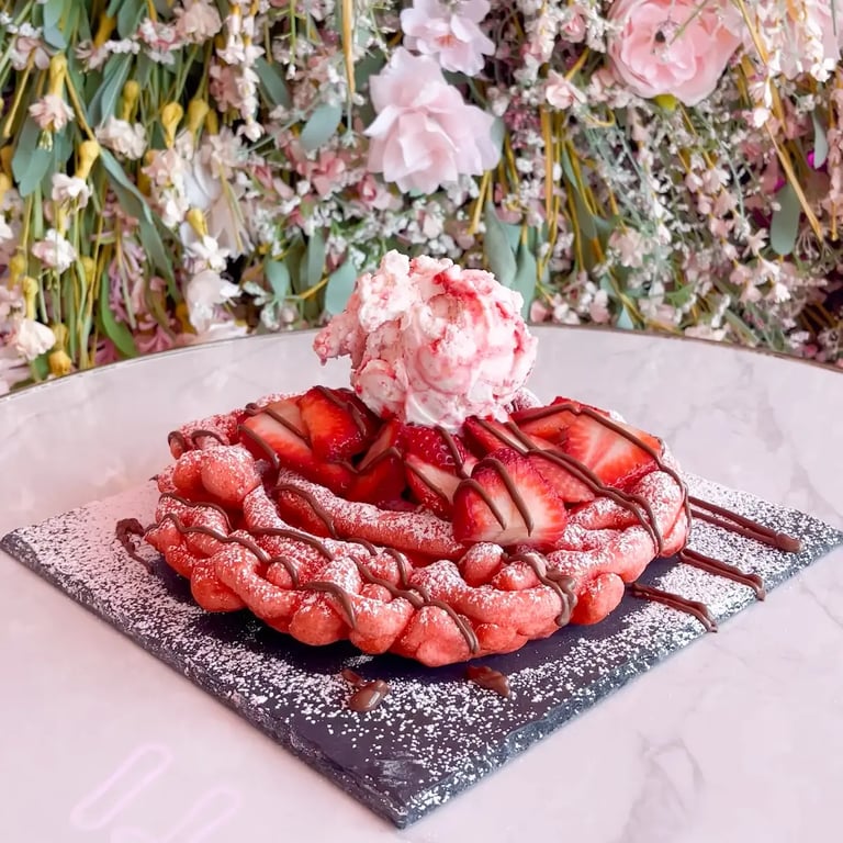 Fried funnel cake with strawberries at The Sweet Spot