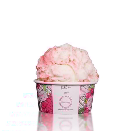 Vanilla ice cream with a strawberry swirl, strawberries, and vanilla crunchies.