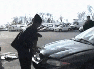 Animated gif of a man opening a car bonnet and being scared