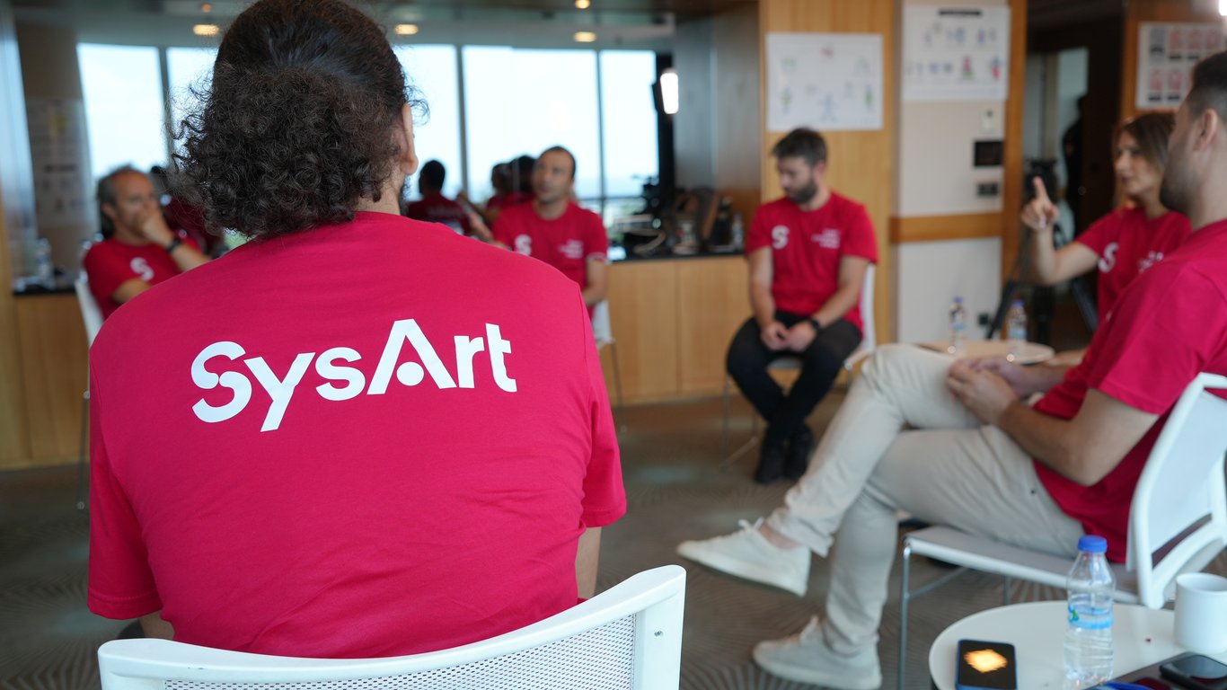 Sysart team talking about agility opportunities in a meeting.