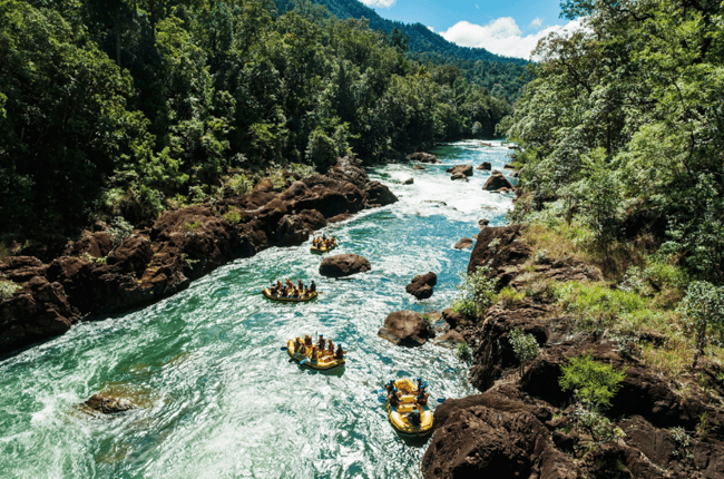 Gorgeous scenery of the River in Tully Gorge National Park with white water rafts coming down Cairns Adventure Package Happy Travels