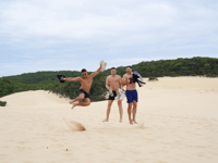 http://Tour%20group%20posing%20on%20sand%20dunes%20at%20K'gari%20Fraser%20Island