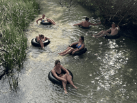 http://Travellers%20floating%20down%20Eli%20Creek%20on%20tubes%20K'gari%20Fraser%20Island