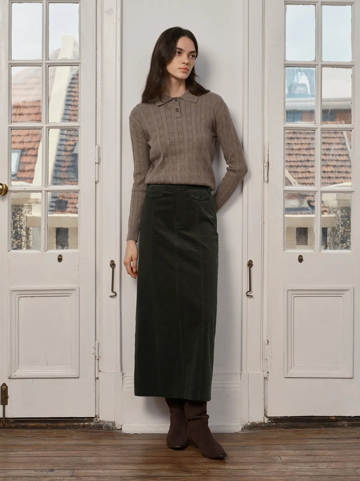 CHIARA Wavy Corduroy Midi Skirt styled with beige ribbed polo sweater and brown boots by French doors