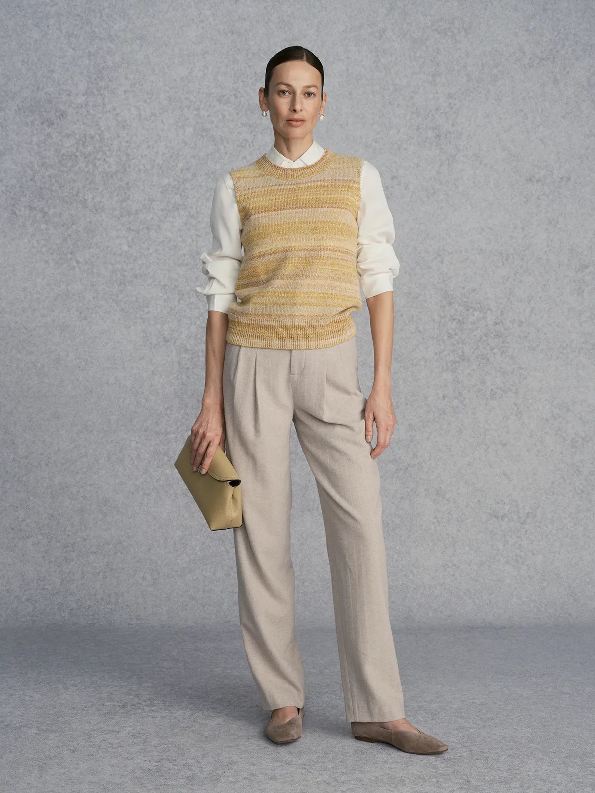 Front full-length view of RIPPLE Knit Jumper with cream blouse and beige trousers, poised elegance