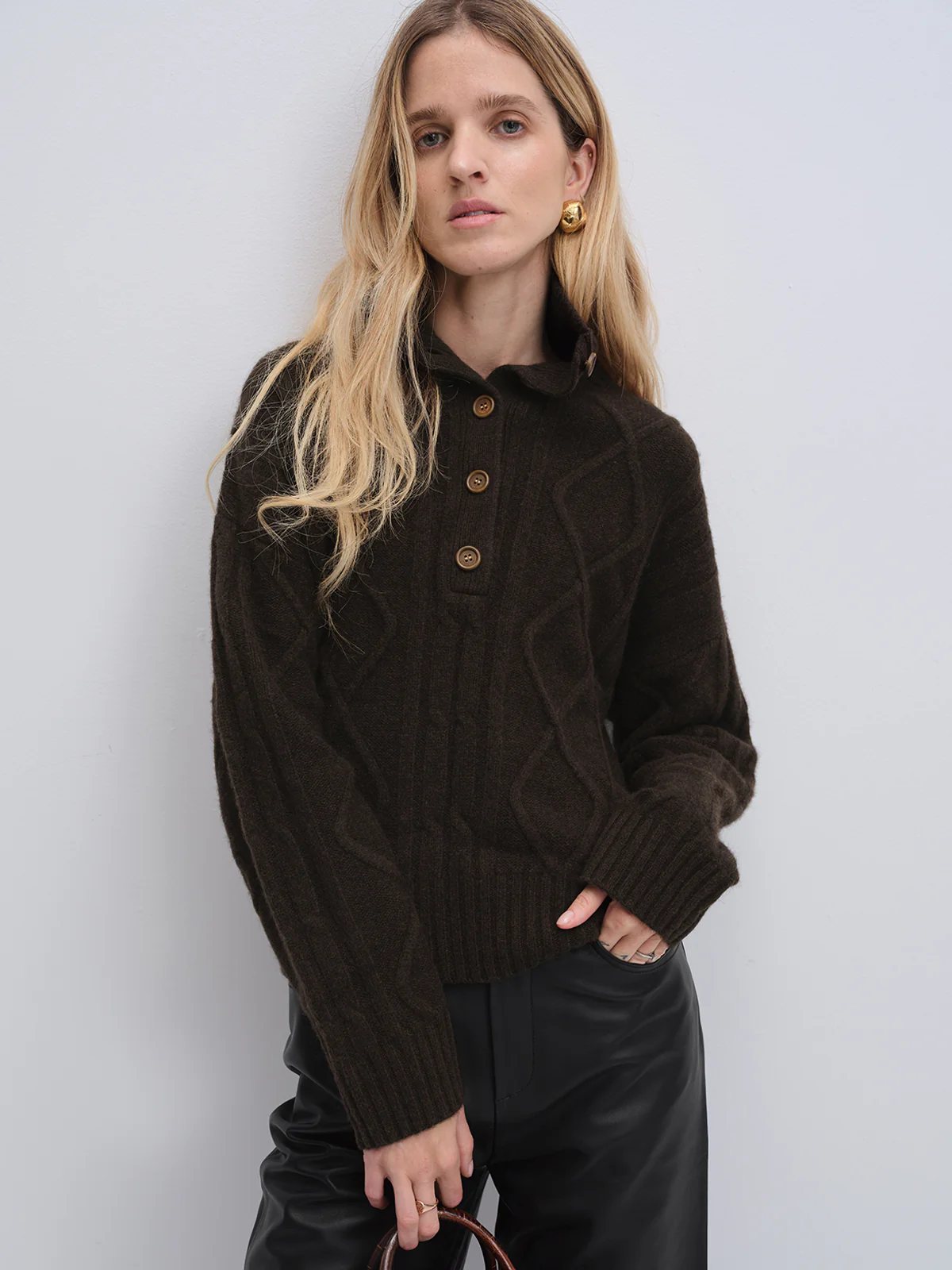 Close-up of andreatang dark brown yak and wool cable-knit sweater with buttoned collar