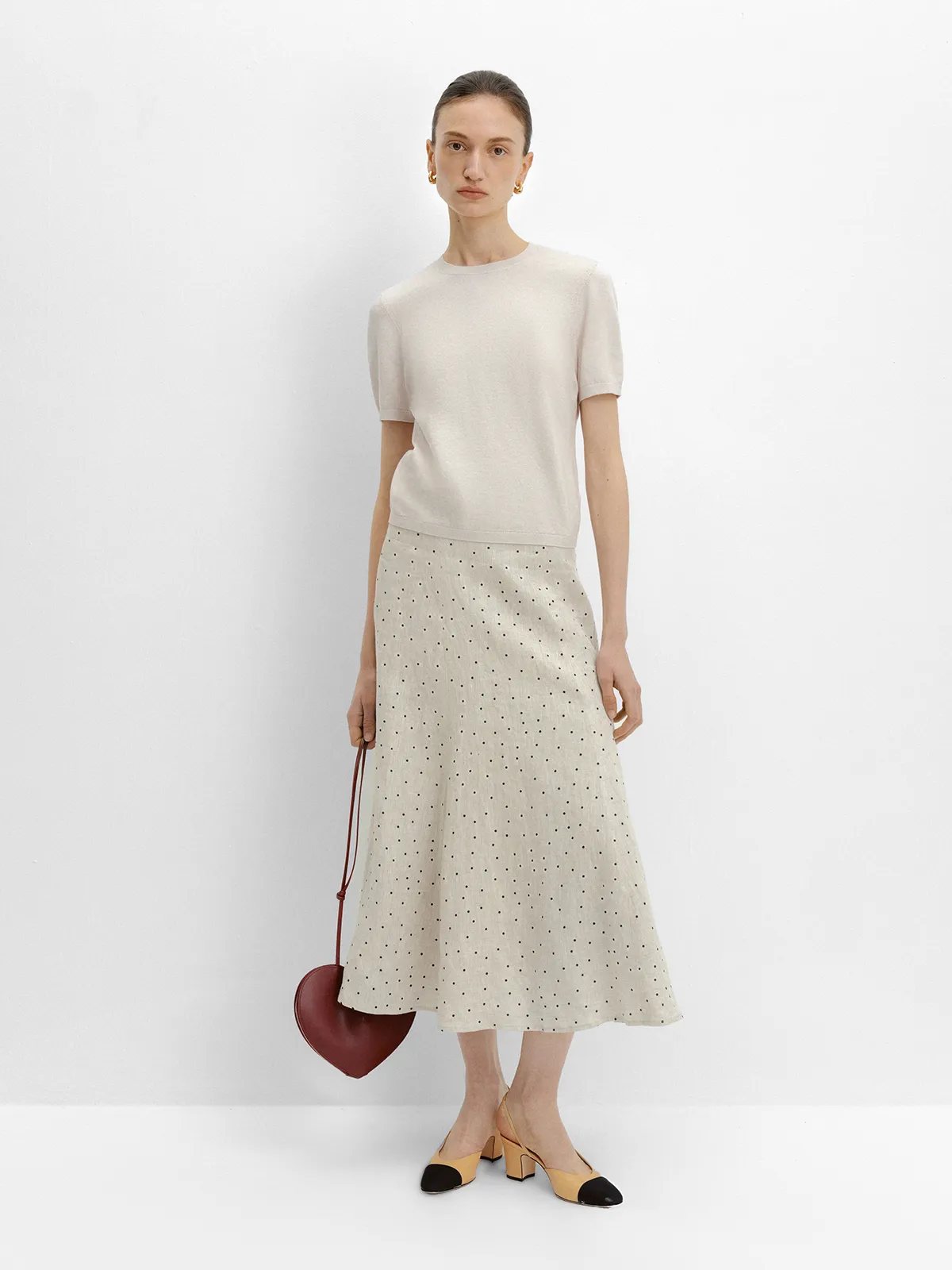 andreatang DOTTIE skirt with ivory short-sleeve knit, heart-shaped burgundy bag, front full view