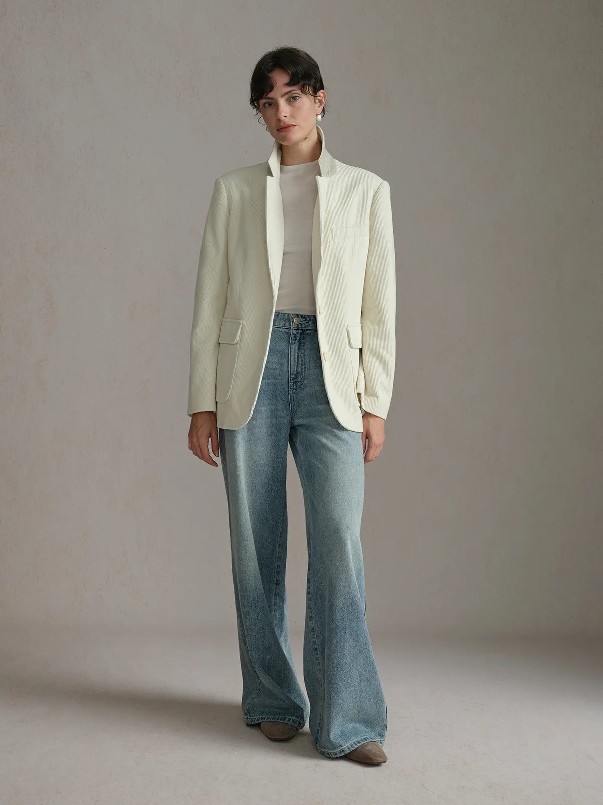 Full-length view of KIMBERLEY corduroy blazer paired with beige knit top and flared wide-leg jeans