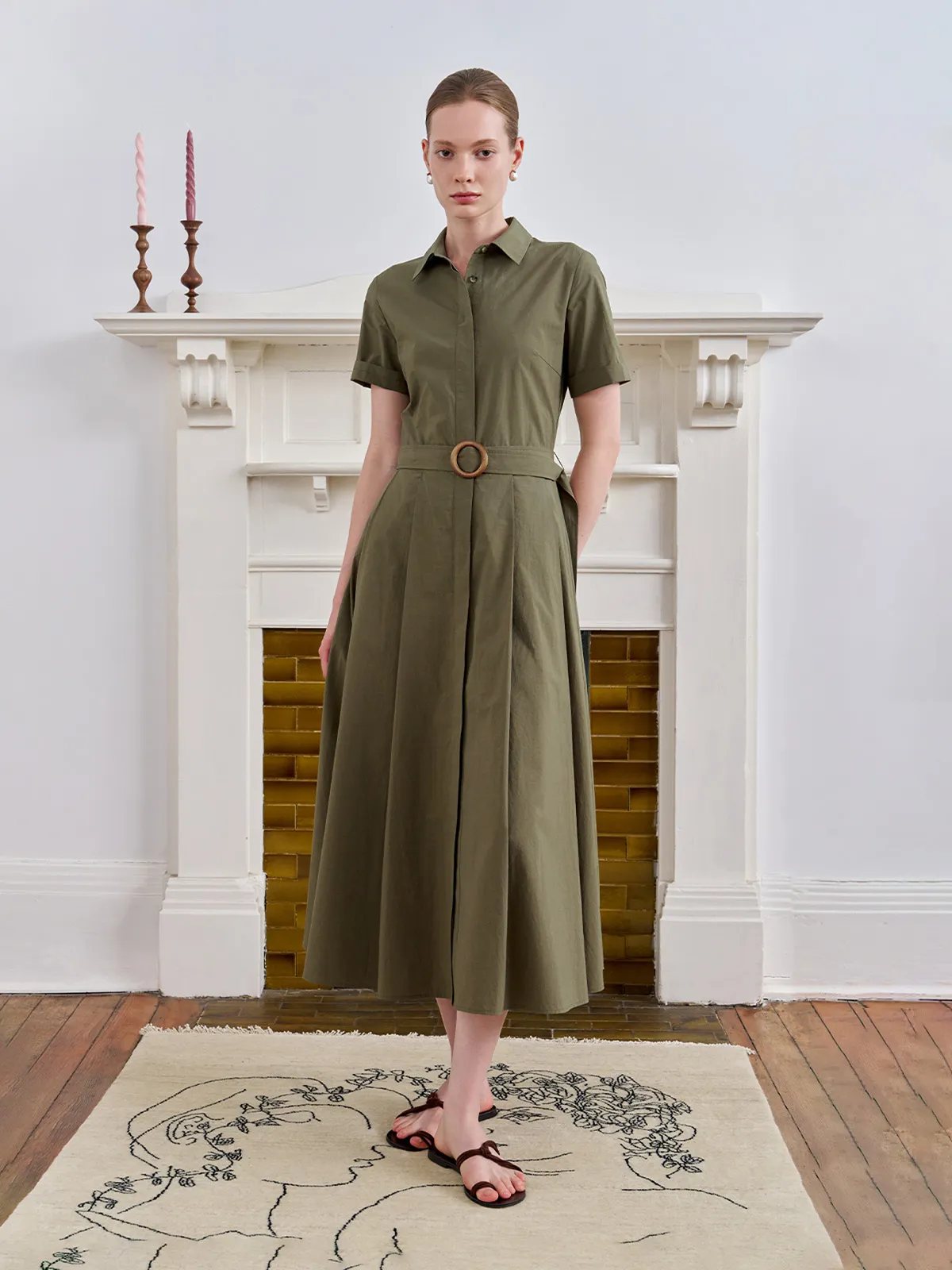 IMANI shirt dress front pose with hands behind back, clean lines and structured pleats