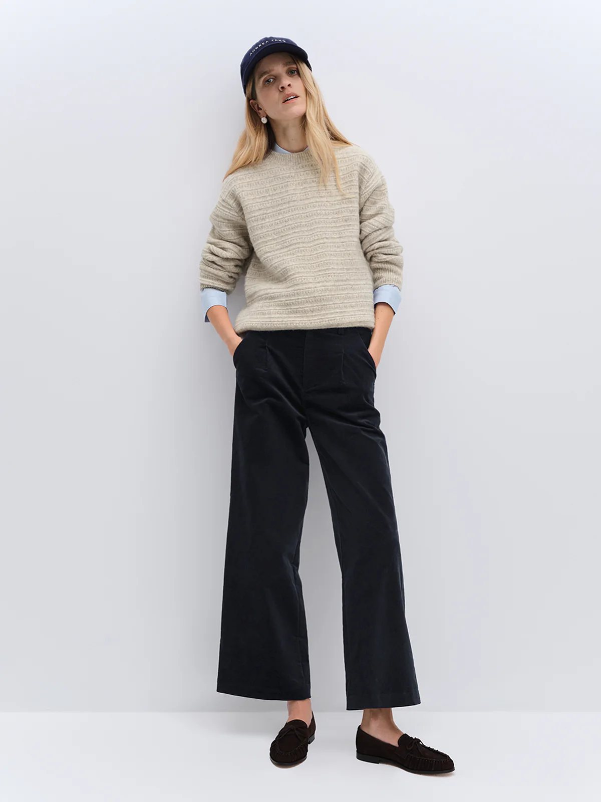 andreatang oatmeal painterly-stripe wool-cotton sweater with navy wide-leg trousers and baseball cap