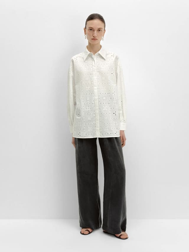 andreatang NOBU Trousers in charcoal grey paired with white eyelet shirt, full-body front view against white studio background