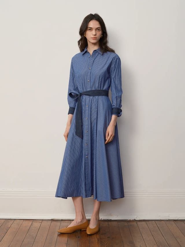 Andreatang BLUE SAIL Midi shirt dress in blue stripe, full front view with navy fabric belt tied at waist, minimalist styling on model against white wall