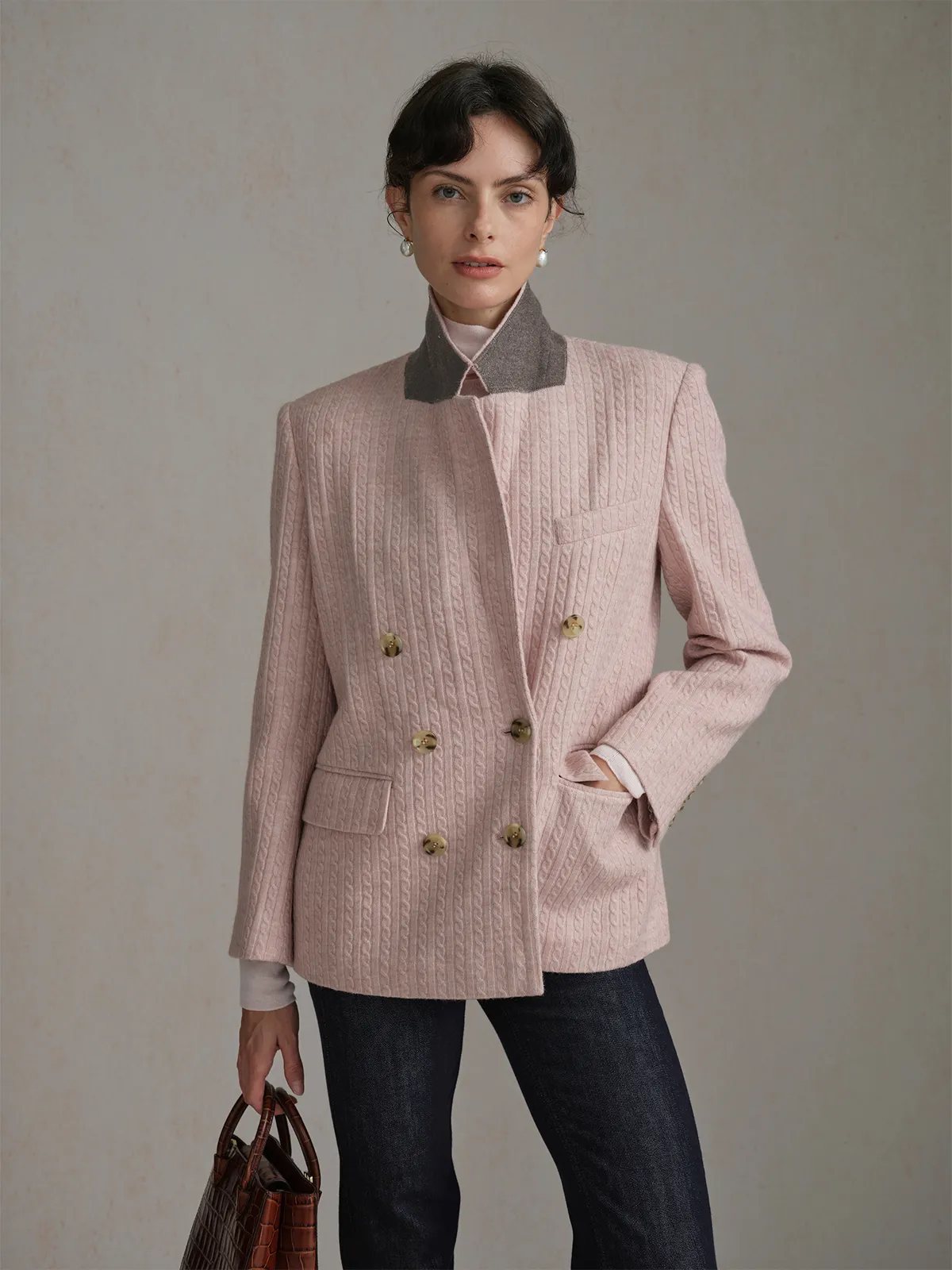 Model in dusty pink HARLOW blazer with grey contrast collar, holding brown croc bag—three-quarter front pose