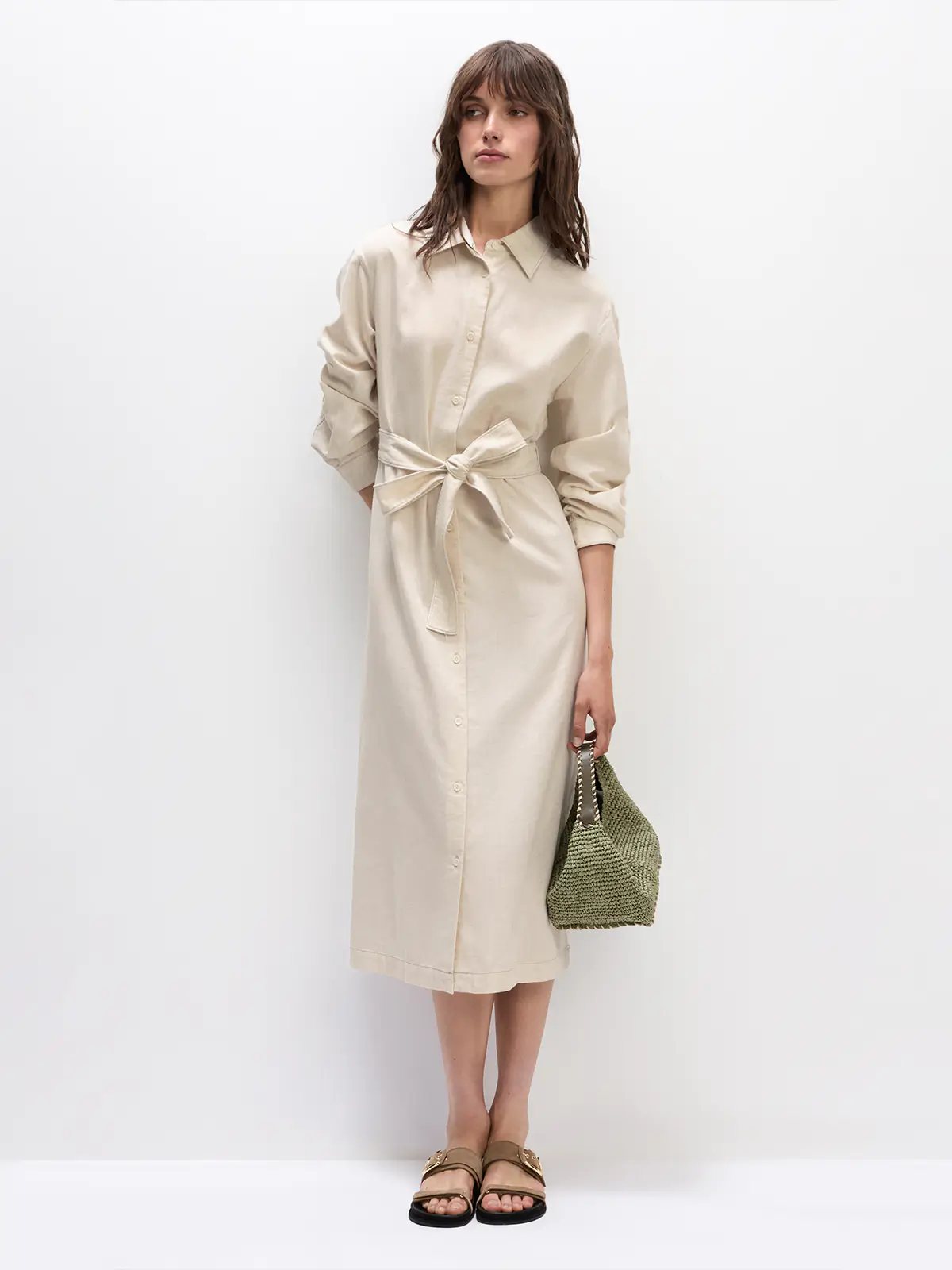 Model wears the Natural JOANNA shirt dress with rolled sleeves, front buttons, and a tie belt at the waist.