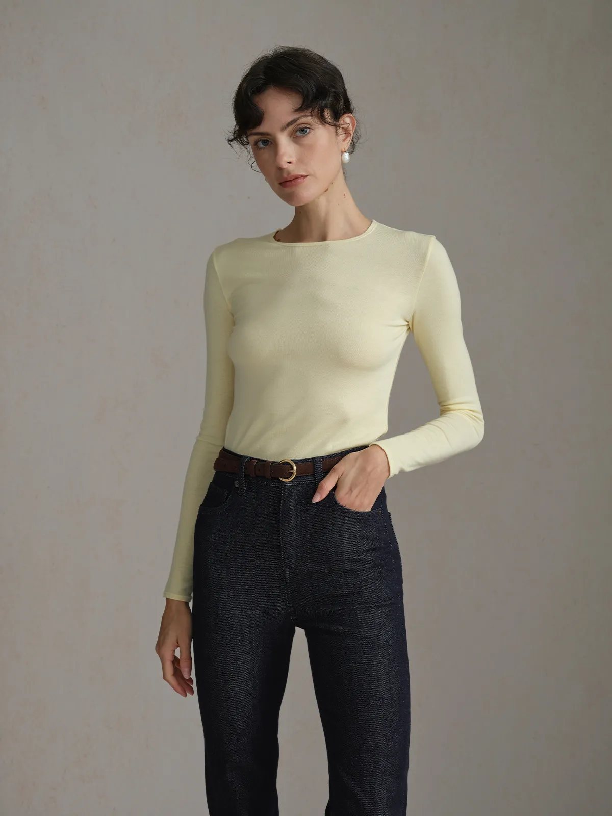 Andreatang TRISTA pale yellow long sleeve t-shirt front close-up, highlighting neckline and shoulder fit