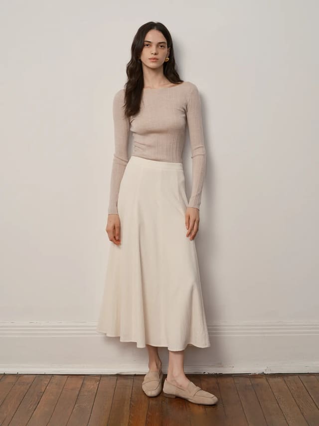 Andreatang MILIAN ivory corduroy A-line maxi skirt full-length front view with beige ribbed top and loafers