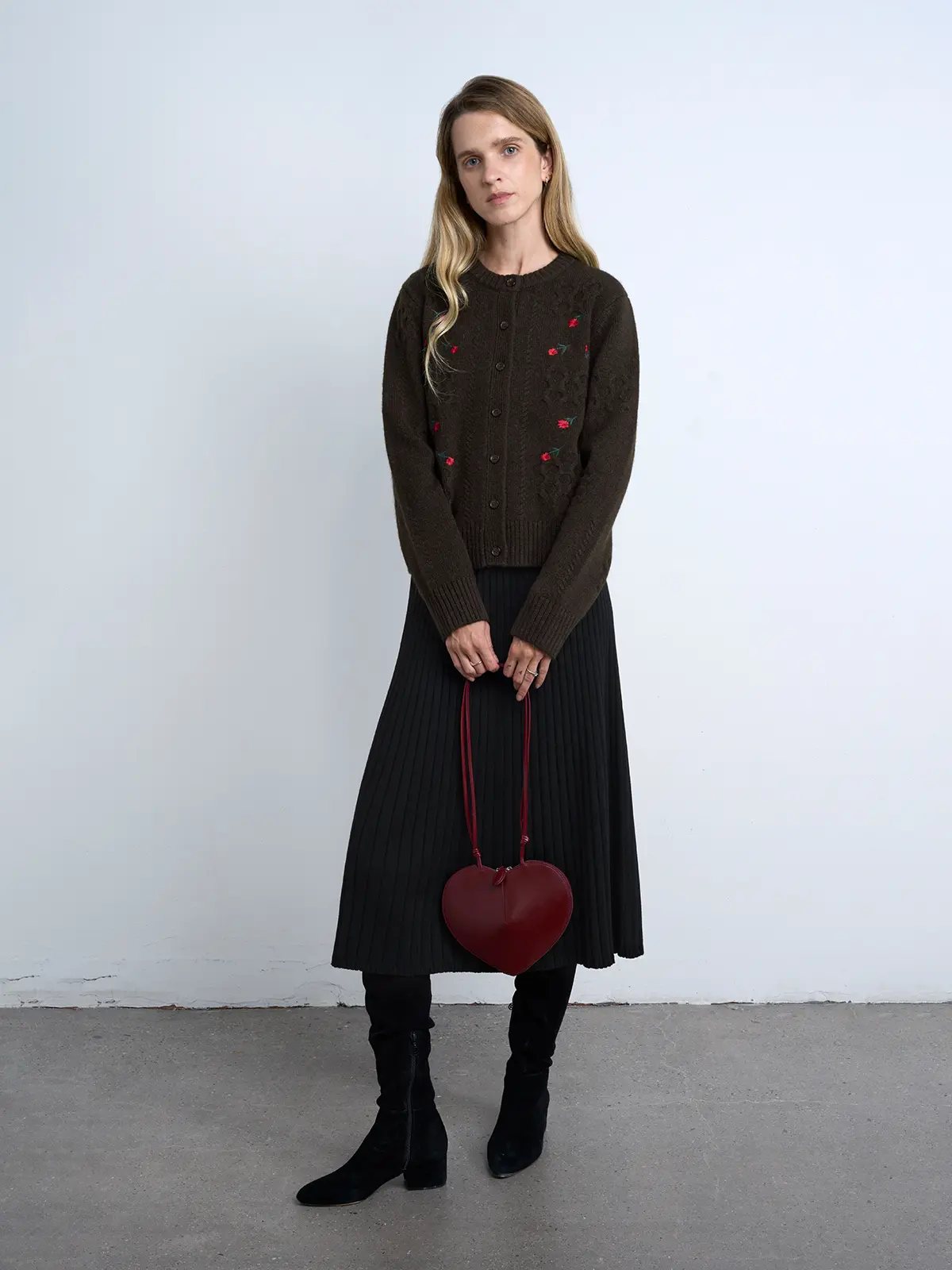 Model wears a Brown yak wool cardigan with floral embroidery, ribbed trim, and button closure.
