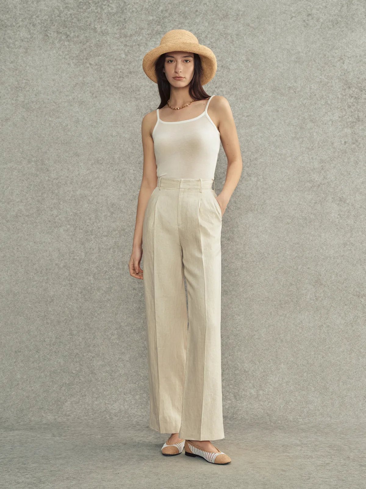 LANA camisole in ivory paired with beige linen trousers and straw hat — summer quiet luxury outfit
