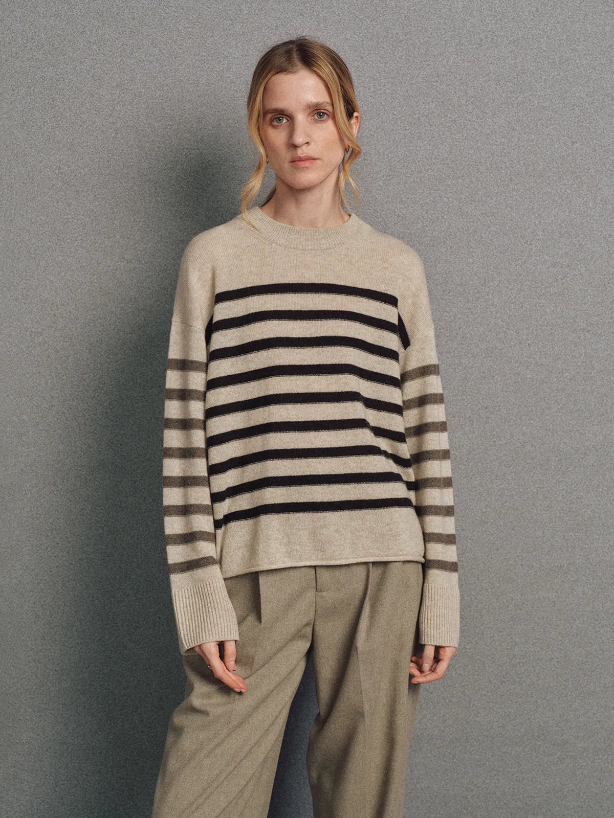 Model wearing a Light Brown contrast stripe cashmere wool jumper, front view with relaxed pose.