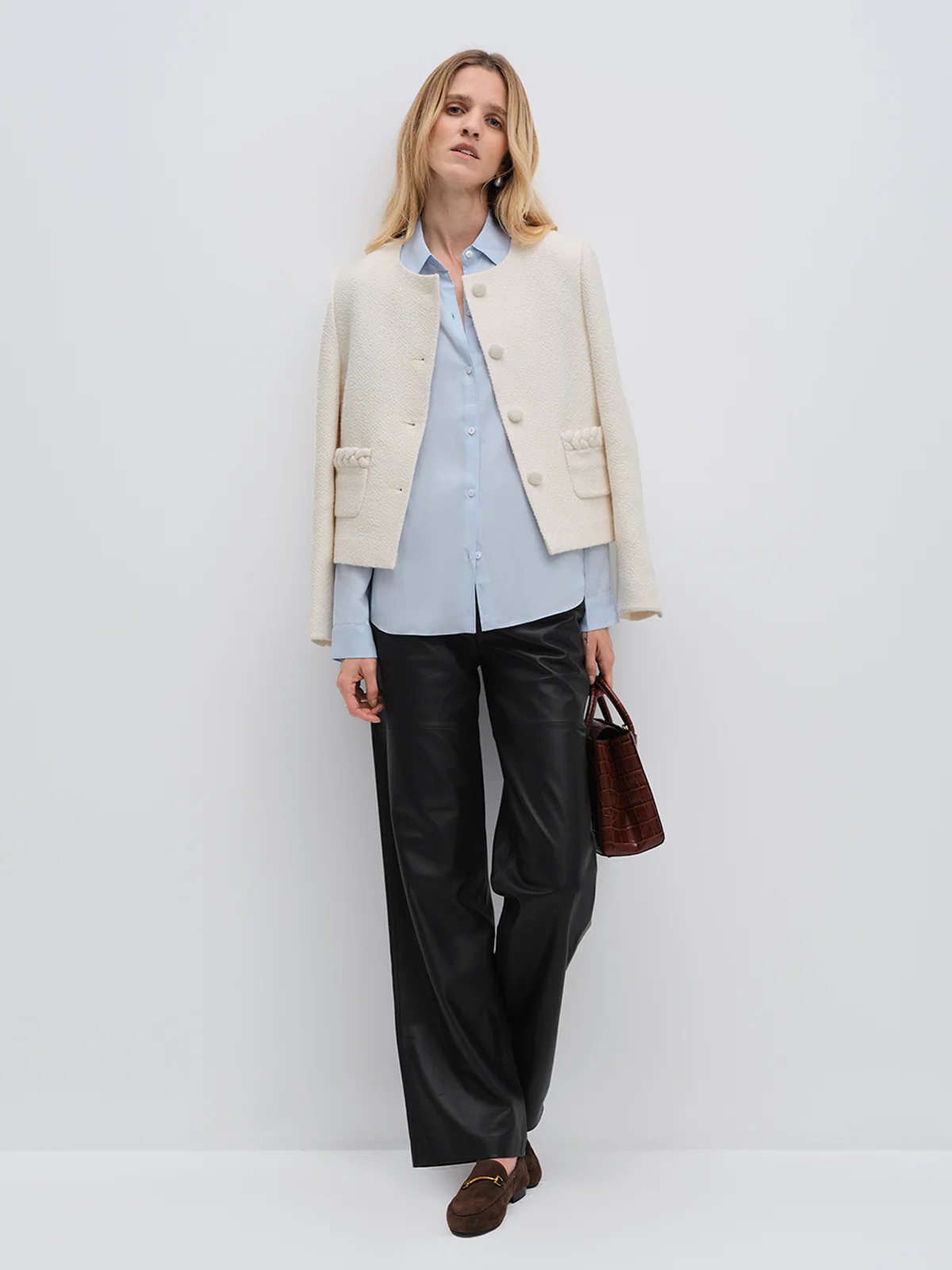 andreatang ivory tweed cropped jacket layered over light blue shirt with black wide-leg trousers and loafers