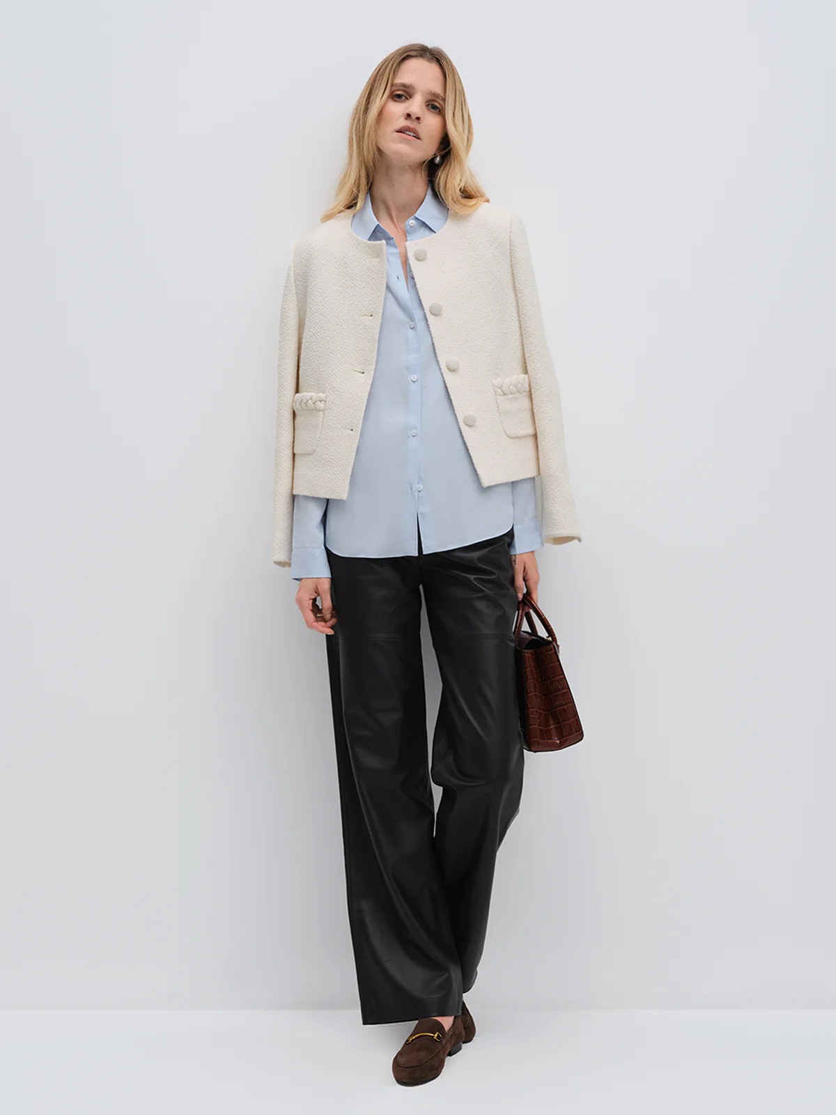 andreatang ivory tweed cropped jacket layered over light blue shirt with black wide-leg trousers and loafers