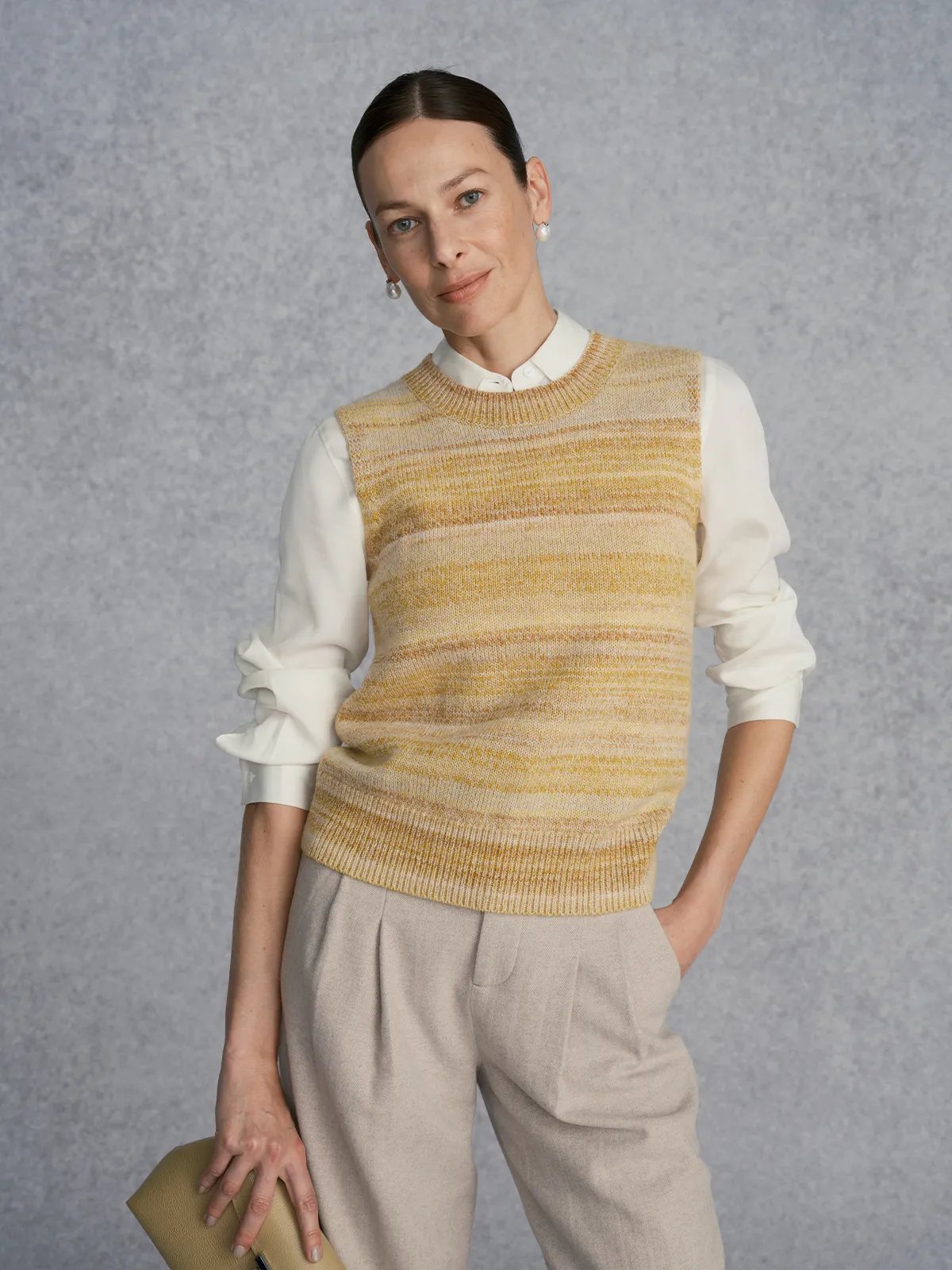 andreatang RIPPLE Knit Jumper styled with white silk blouse and beige pleated trousers, elegant office look