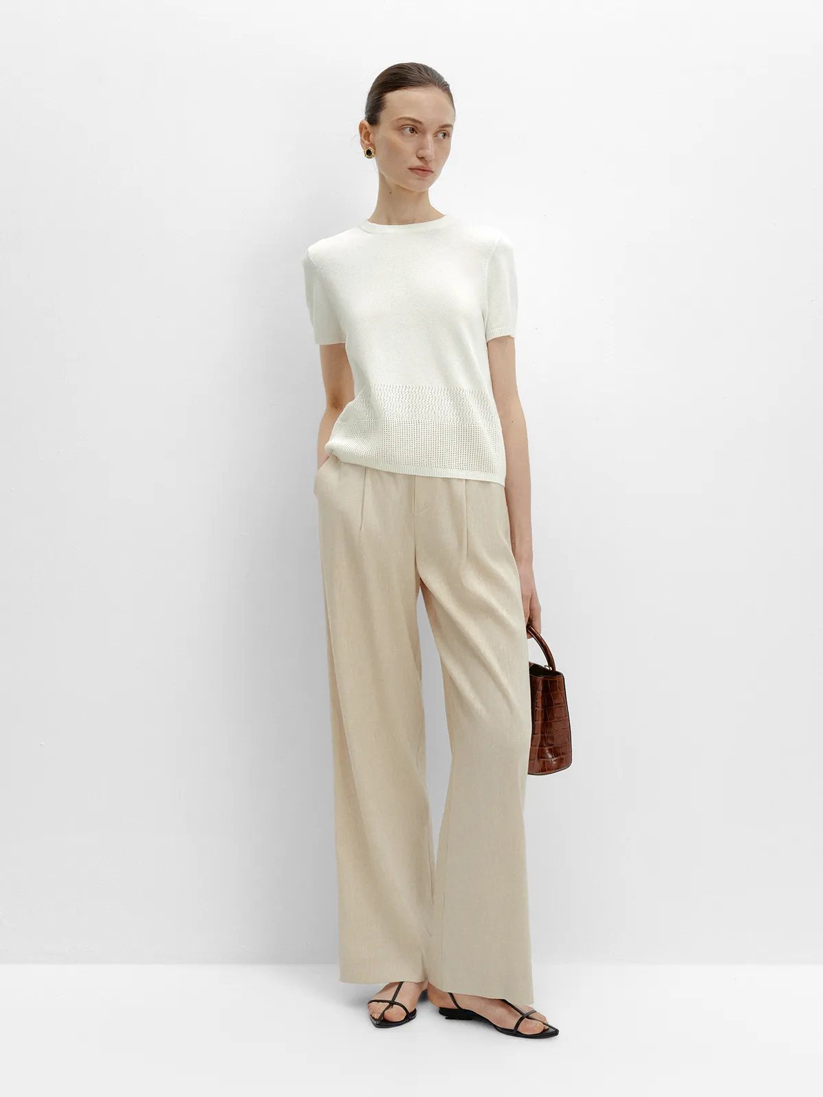 Full front view with short-sleeve knit top, highlighting waistband and overall proportion