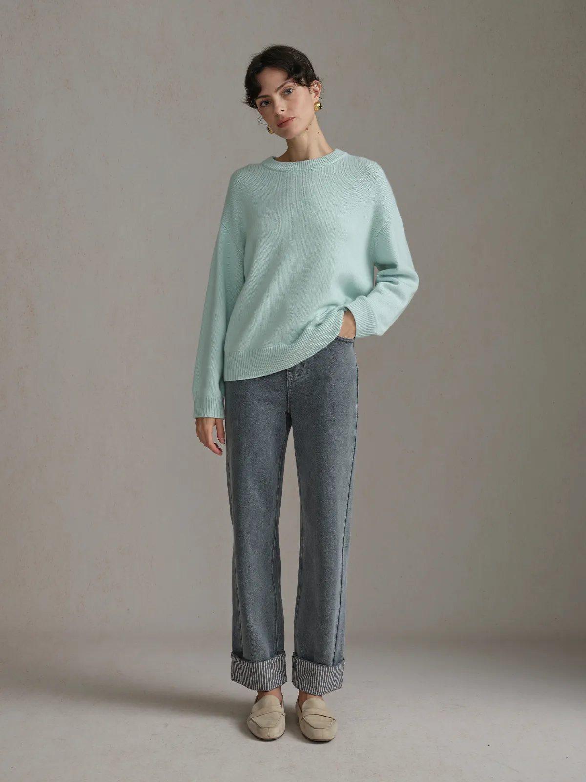 Model in light aqua ribbed knit sweater with FLIPSIDE Stripe Cuffed Jeans and beige loafers