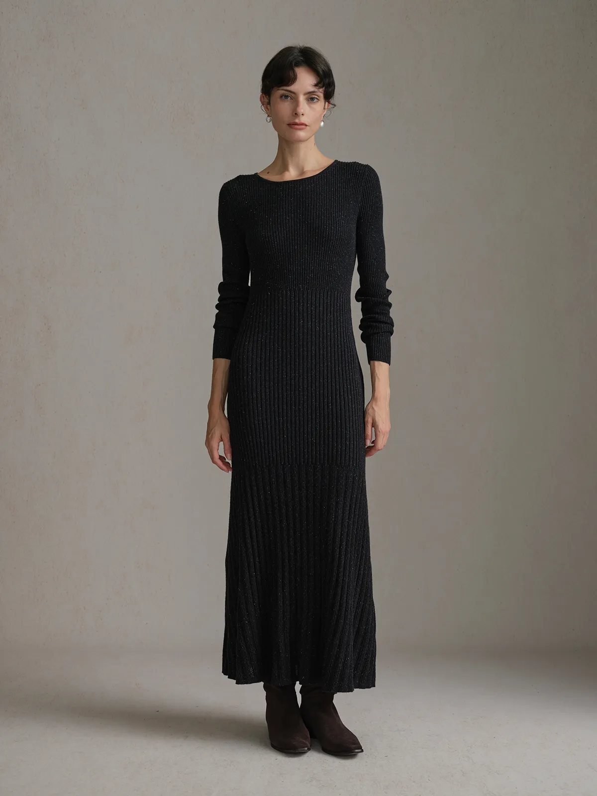 Full frontal pose of model in black BRENDA maxi dress with no layering, showing clean silhouette and side slit