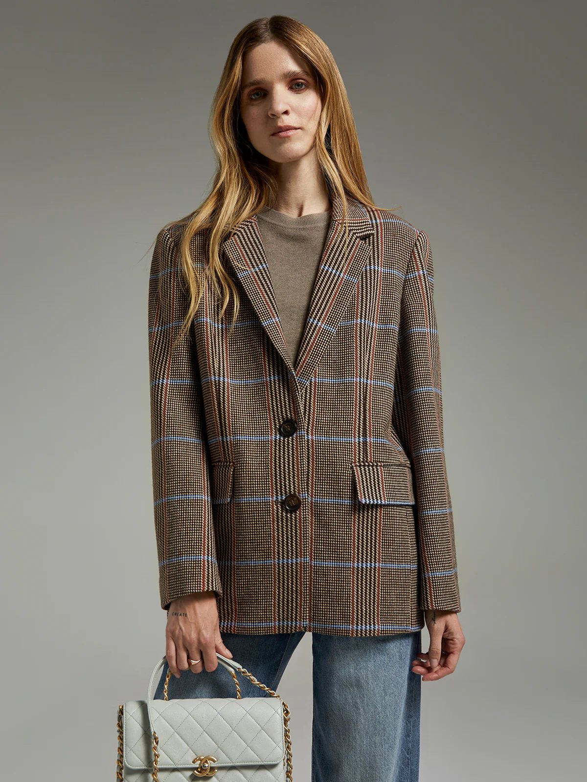 andreatang British check wool blazer layered over black slip dress with knee boots