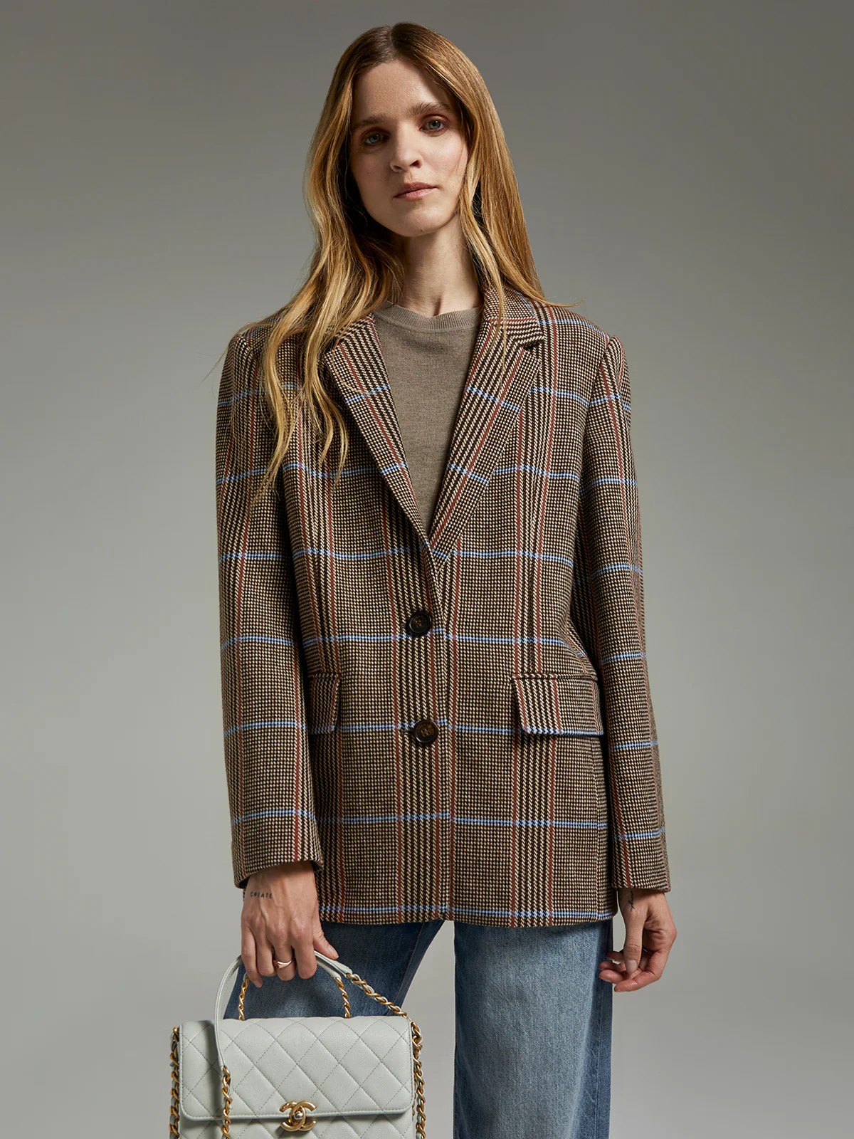 andreatang British check wool blazer layered over black slip dress with knee boots