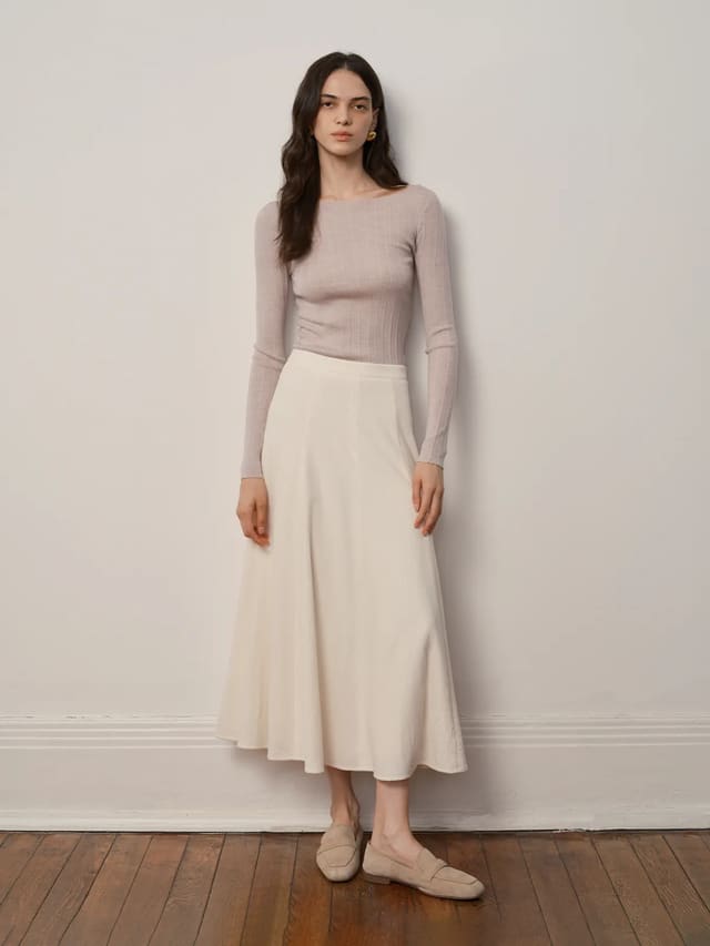 Model wearing Andreatang THERESA boat neck slim fit knit top with cream midi skirt and loafers