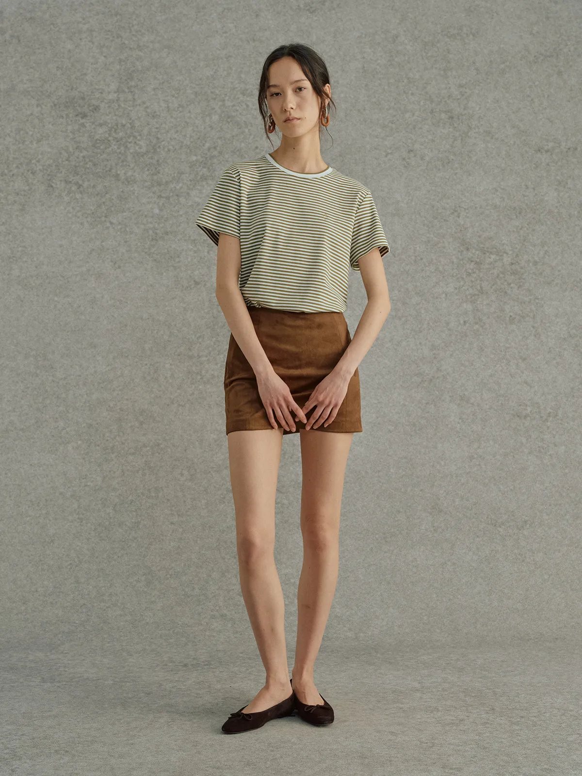 Model wearing FINLEY striped t-shirt with brown suede mini skirt and dark brown ballet flats, front full-length