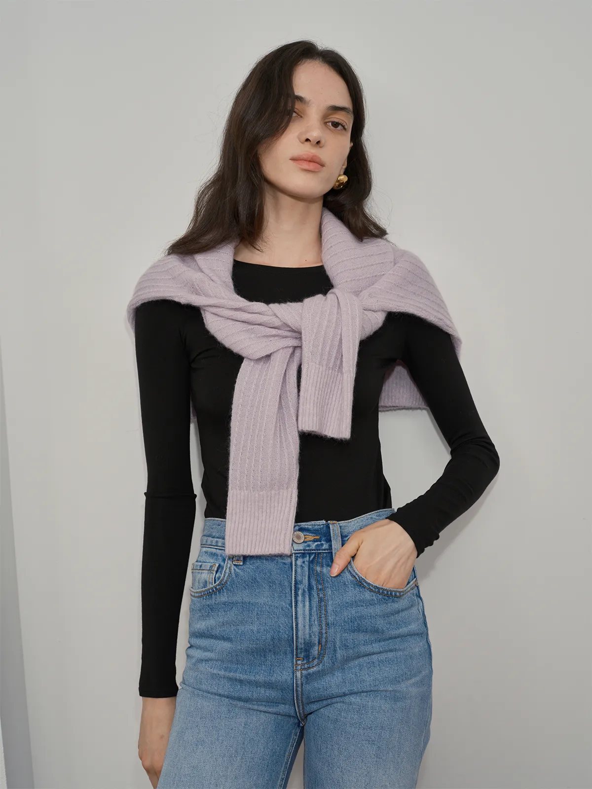 Model wearing black TRISTA long sleeve t-shirt layered under lavender knit scarf, styled with light wash jeans for quiet luxury look