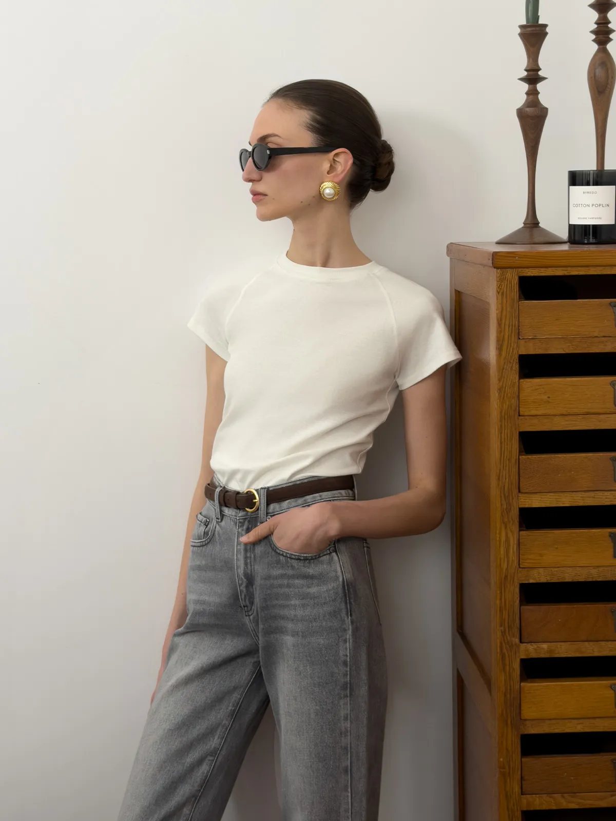 andreatang LUCA white raglan cap sleeve fitted t-shirt styled with grey wide-leg jeans and brown leather belt, Parisian chic minimalist outfit