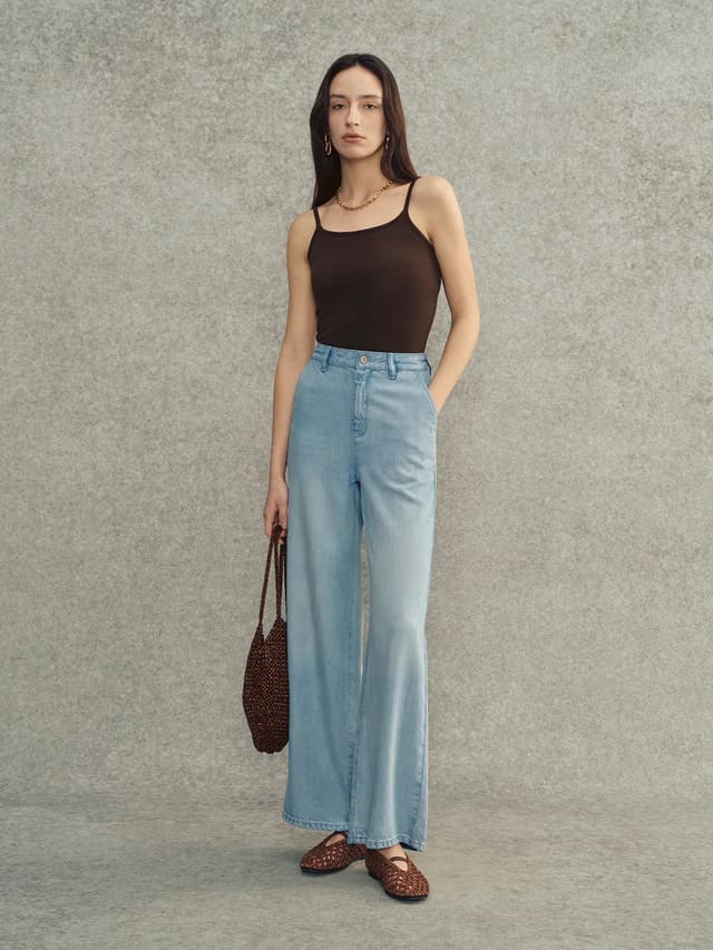 Andreatang LANA camisole in deep brown worn with wide-leg light wash jeans and woven bag — quiet luxury minimalist styling