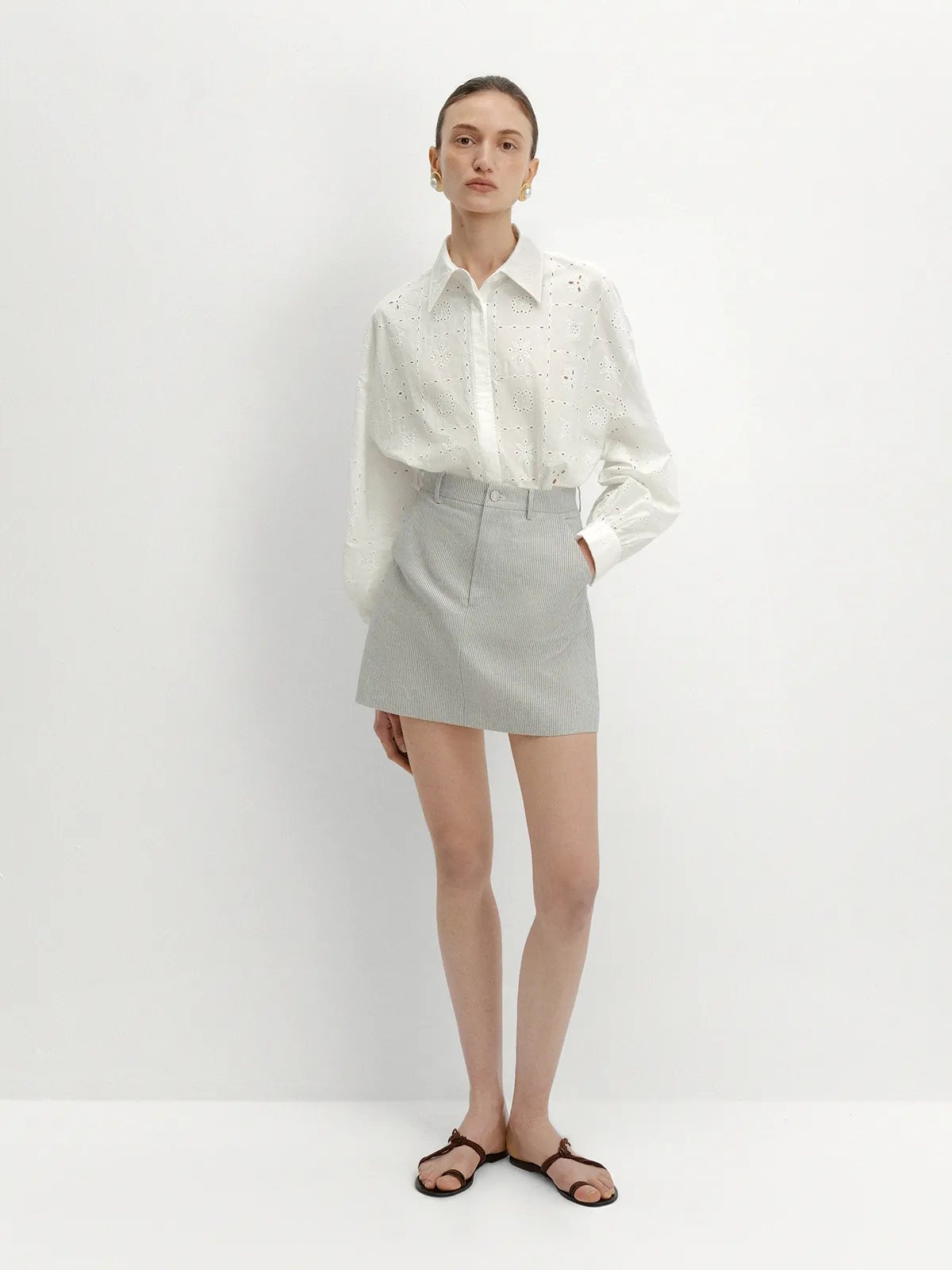 andreatang DEVON Mini Skirt with white broderie anglaise blouse and pearl earrings