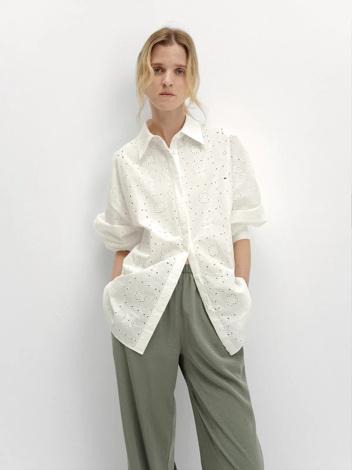 andreatang MINA white eyelet embroidered shirt worn with olive green wide-leg trousers, front view, quiet luxury minimalist style
