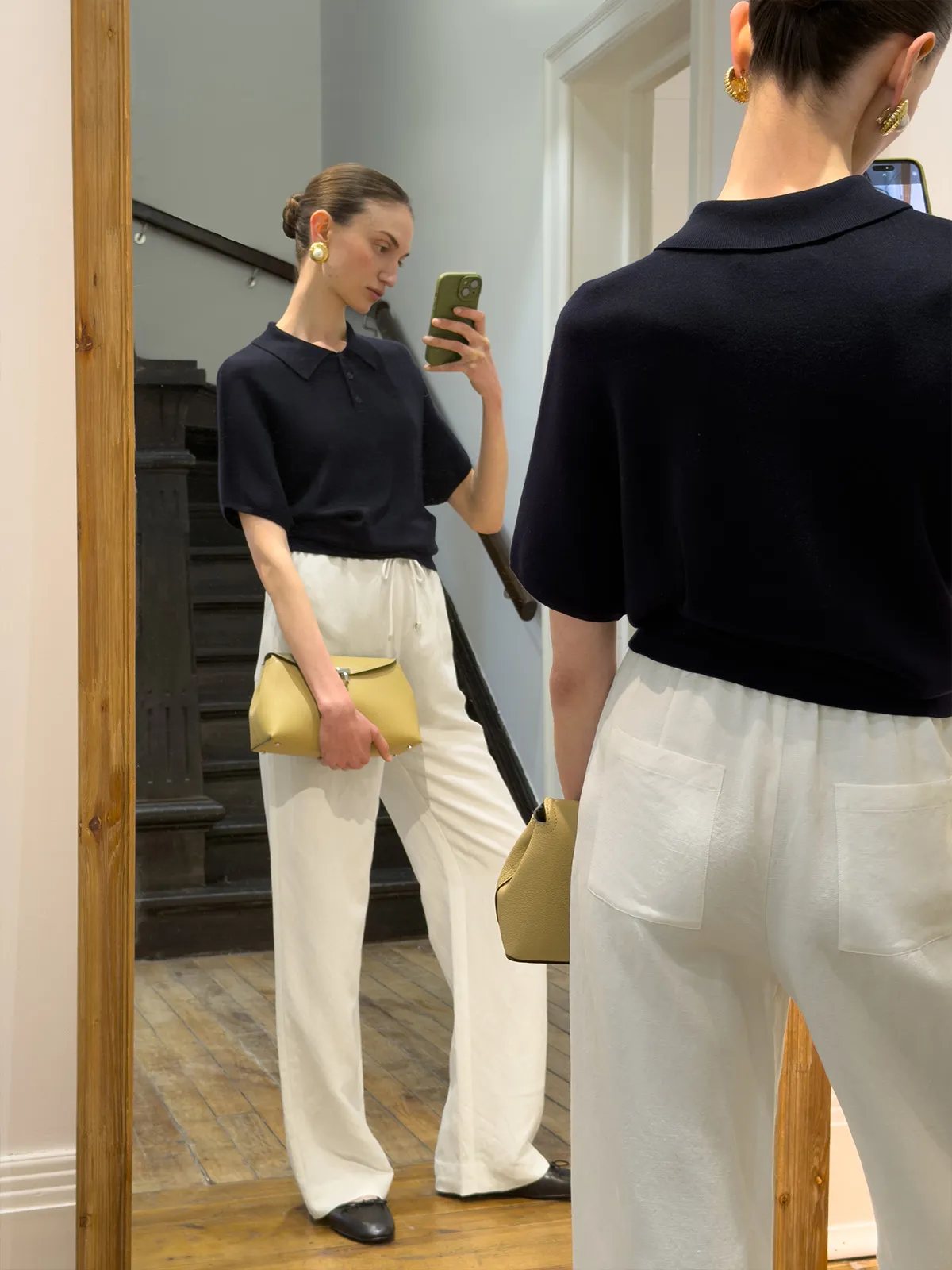 Mirror selfie showing back view of ivory linen trousers with visible rear patch pockets