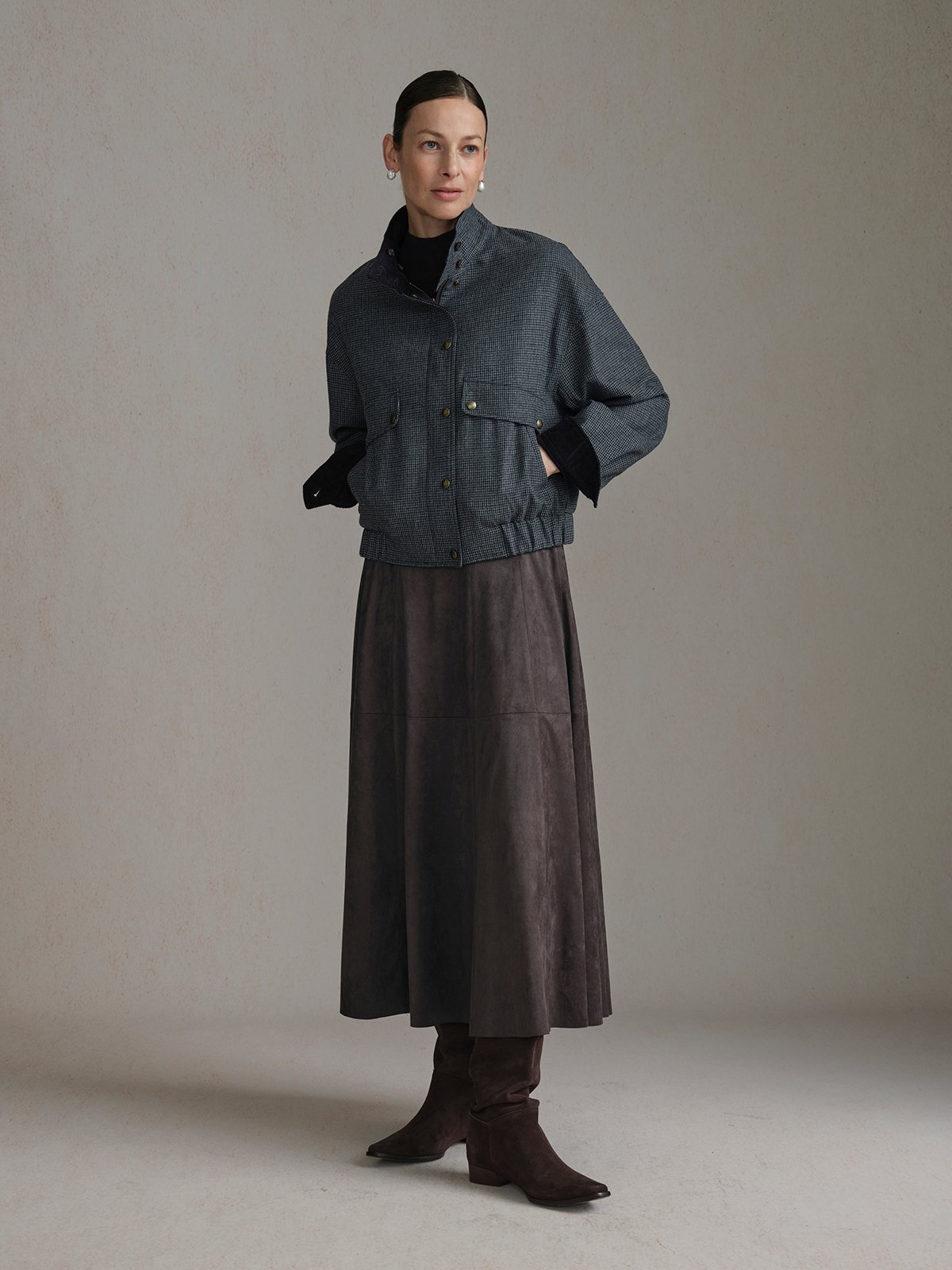 Model wearing the Navy Andreatang CHARLIE houndstooth side with a dark high-neck top, long brown skirt and ankle boots.