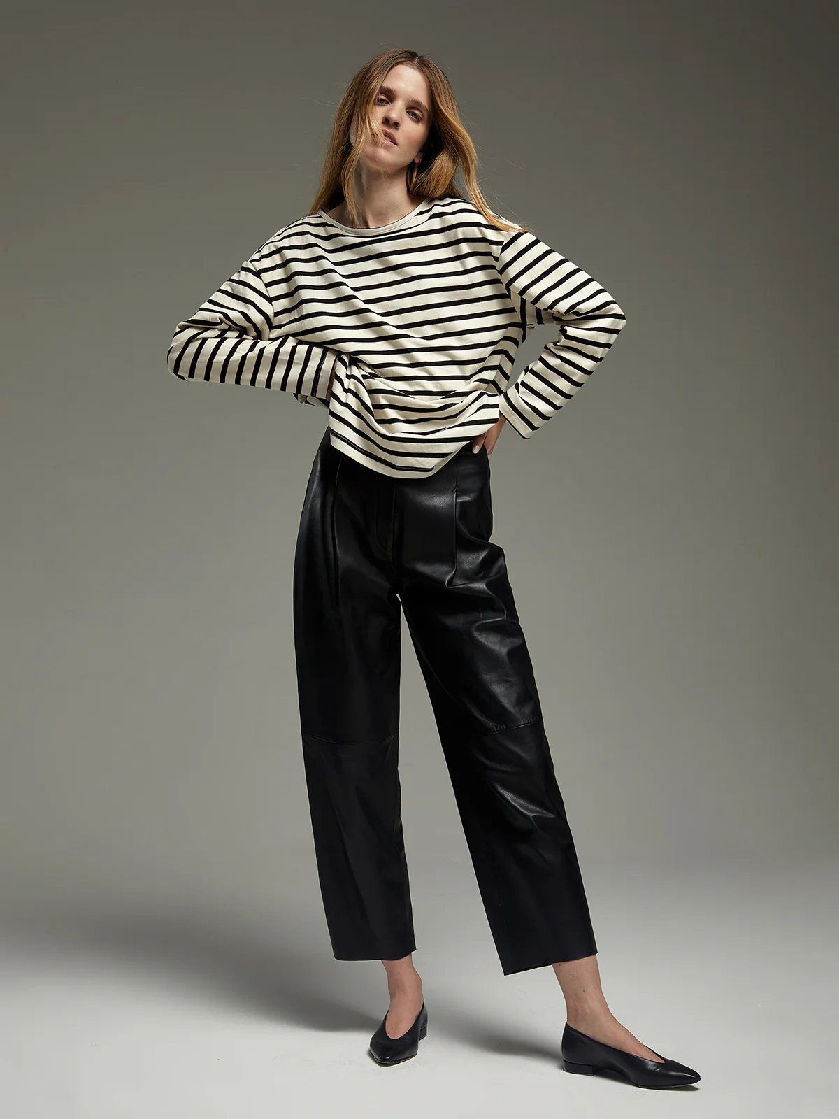 Model wearing a Black/White striped heavyweight cotton t-shirt with dropped shoulders and relaxed fit.